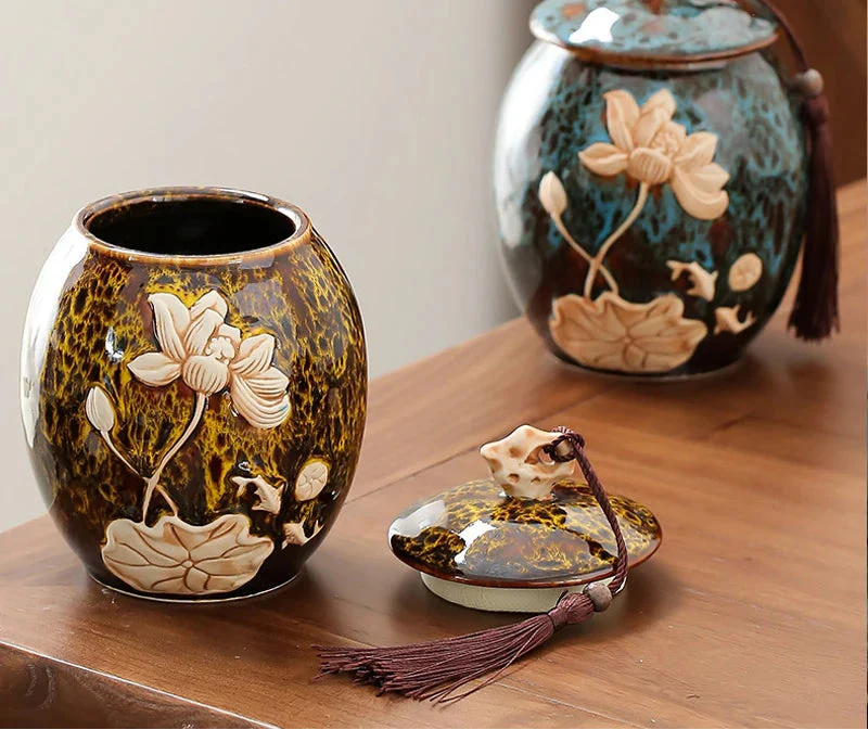 Ceramic jars with floral designs on a wooden surface