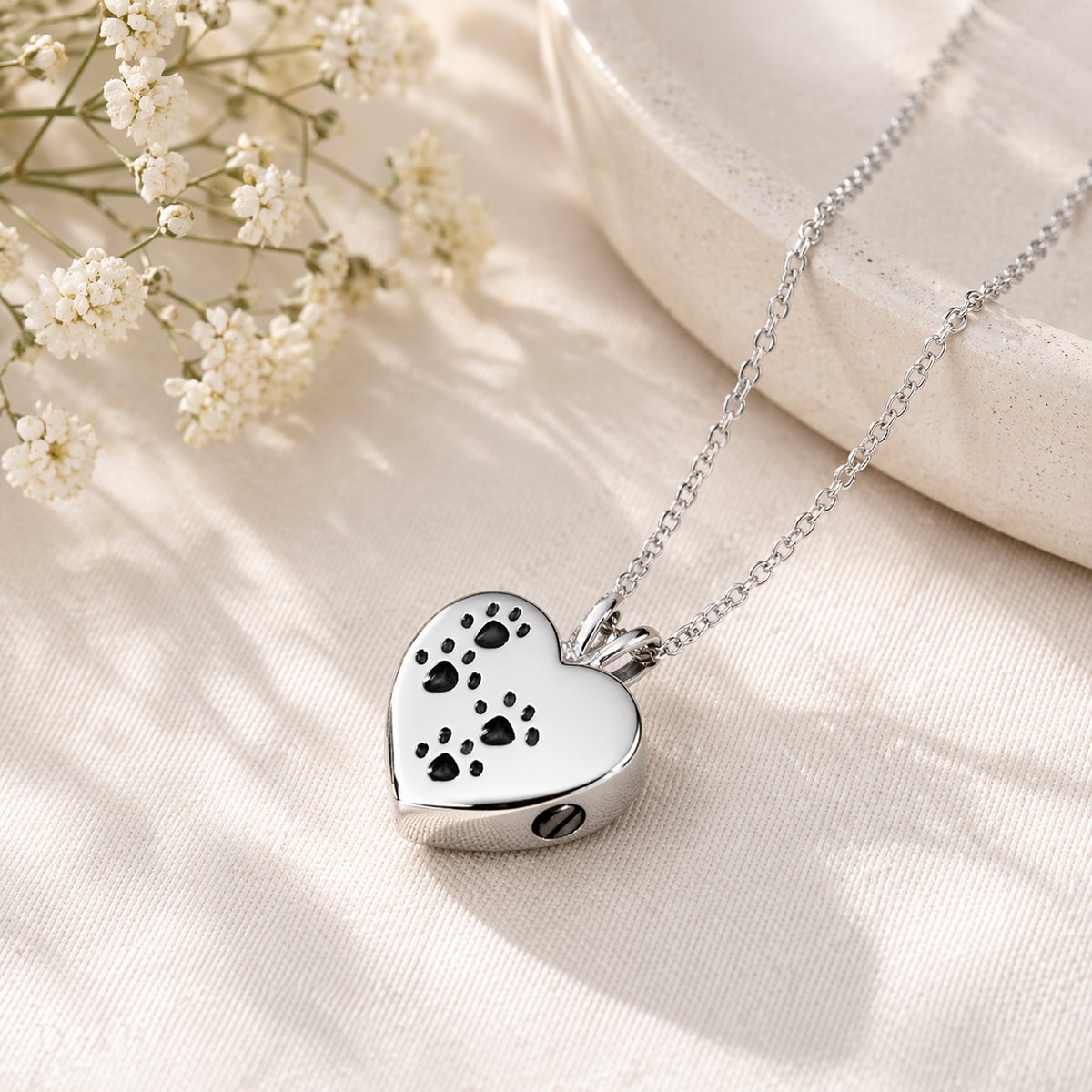 Dog Ashes Jewellery "Heart & Paw Print" showing heart-shaped pendant with paw print motif